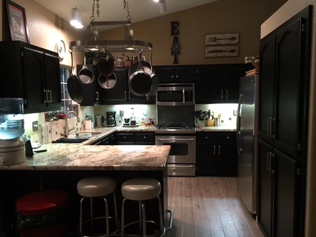 The same kitchen after Talbot Painting refinished the cabinets in a deep espresso finish