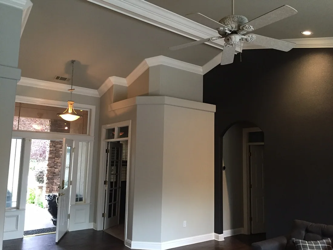 Home entry and hallway with freshly painted walls and white trim