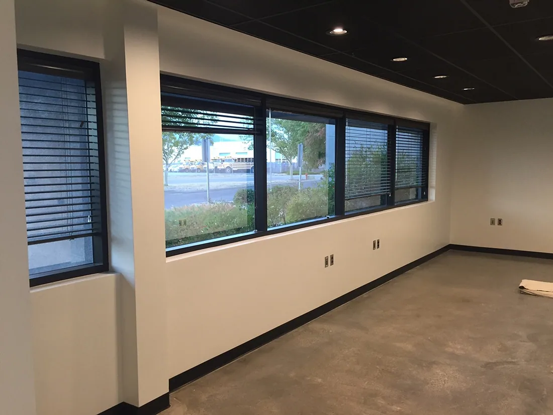 Commercial interior space with painted walls, columns and ceiling