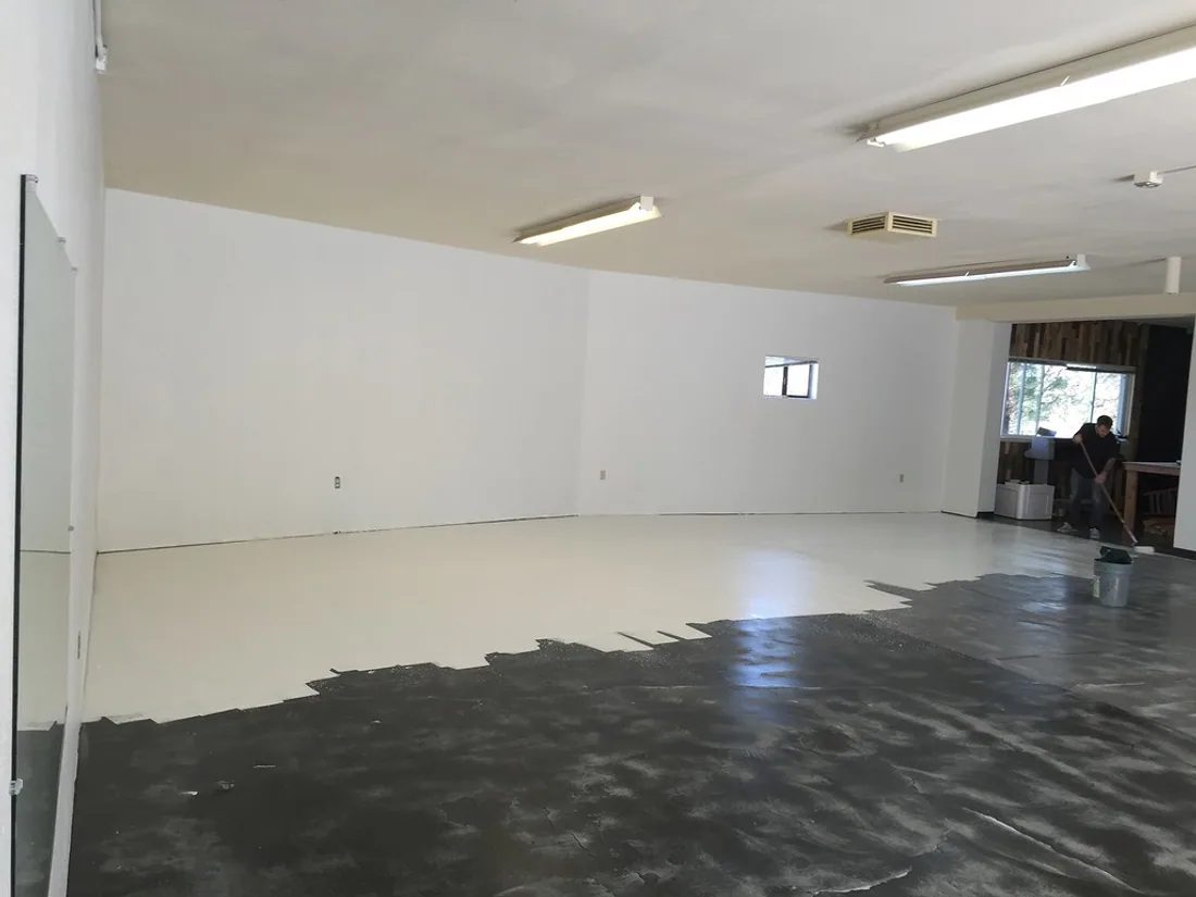 Large empty commercial interior with freshly painted white walls