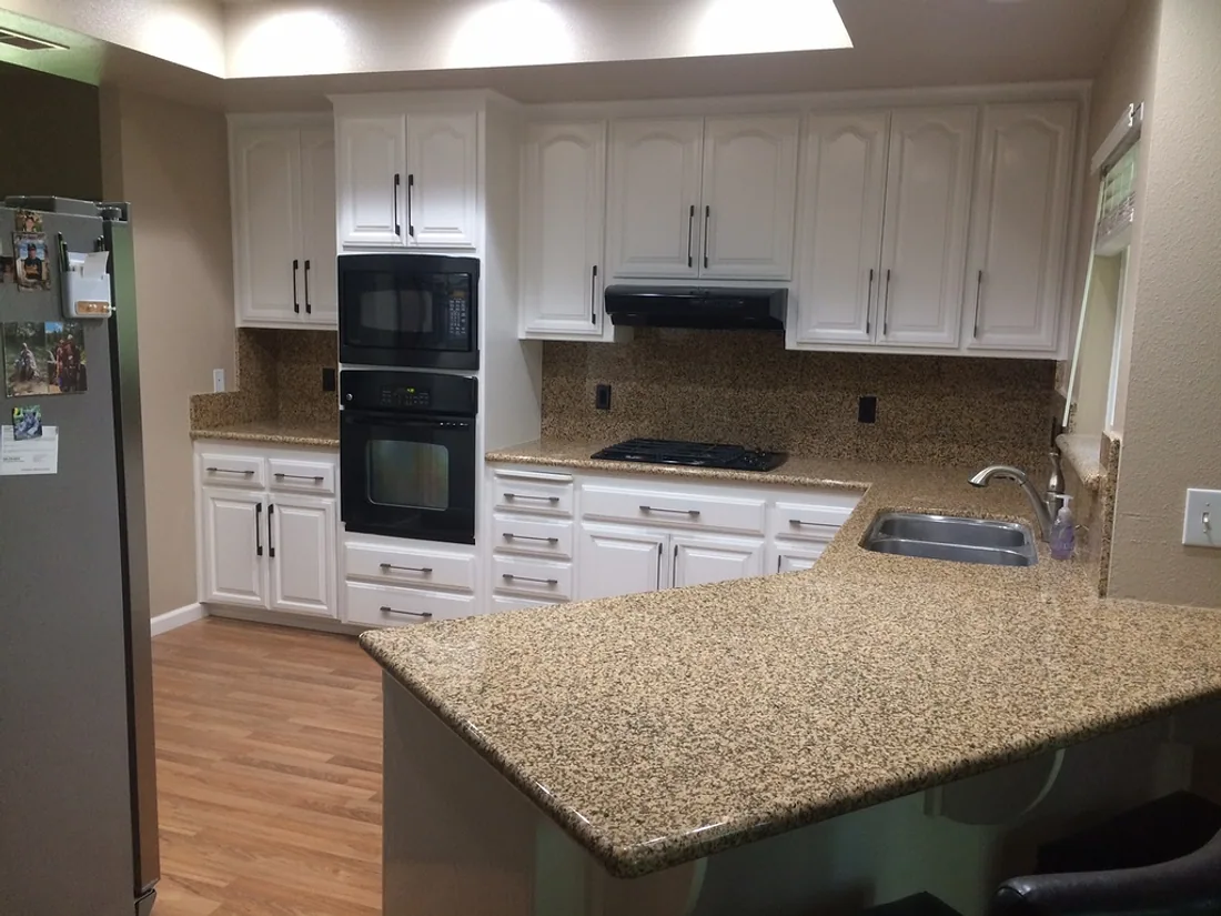 The same kitchen after the cabinets were painted white