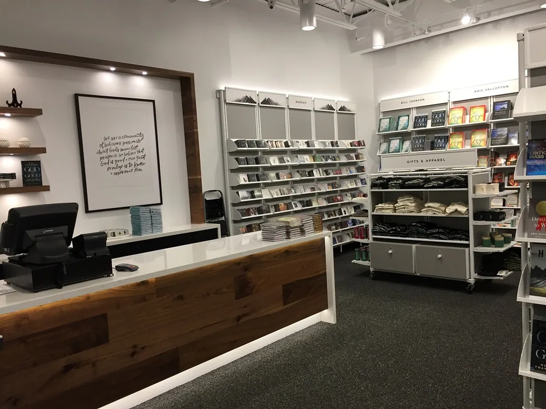 Retail interior with painted walls and ceiling, shelving and a reception counter